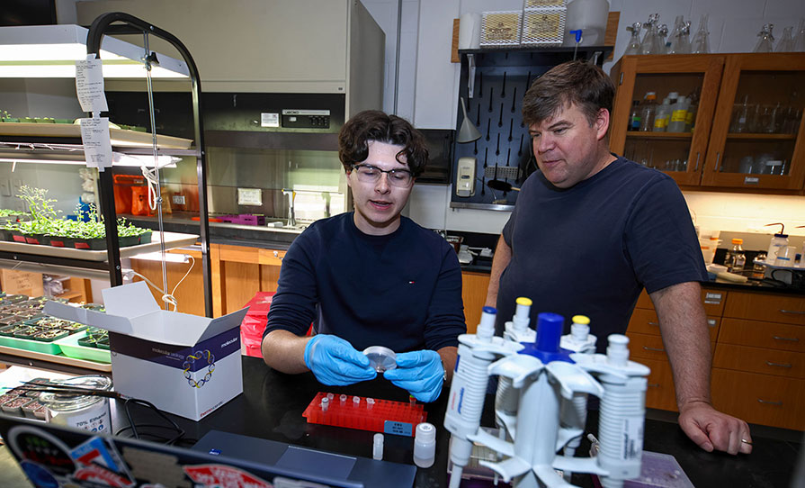 Andy Weisgerber ’27 (left) and professor Chris Wolverton