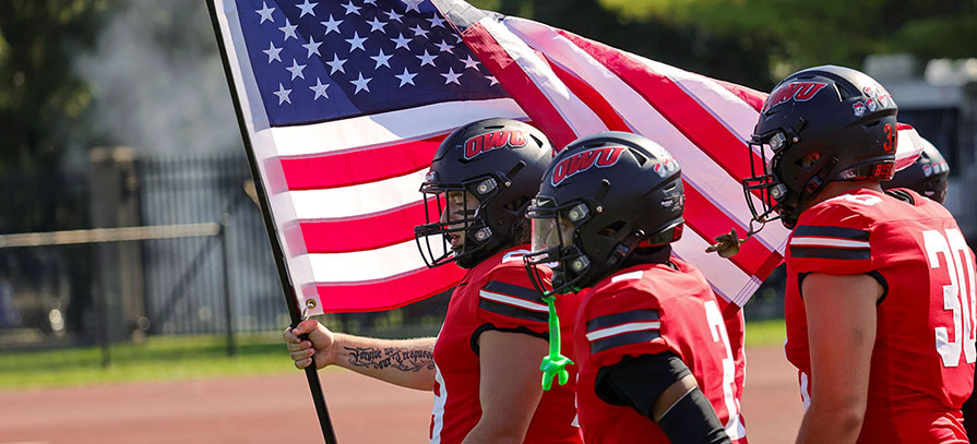 OWU Football Players Carrying the U.S. Flag